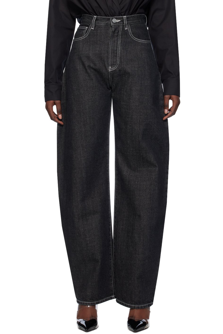 ALAÏA - Jean noir à coutures extérieures incurvées