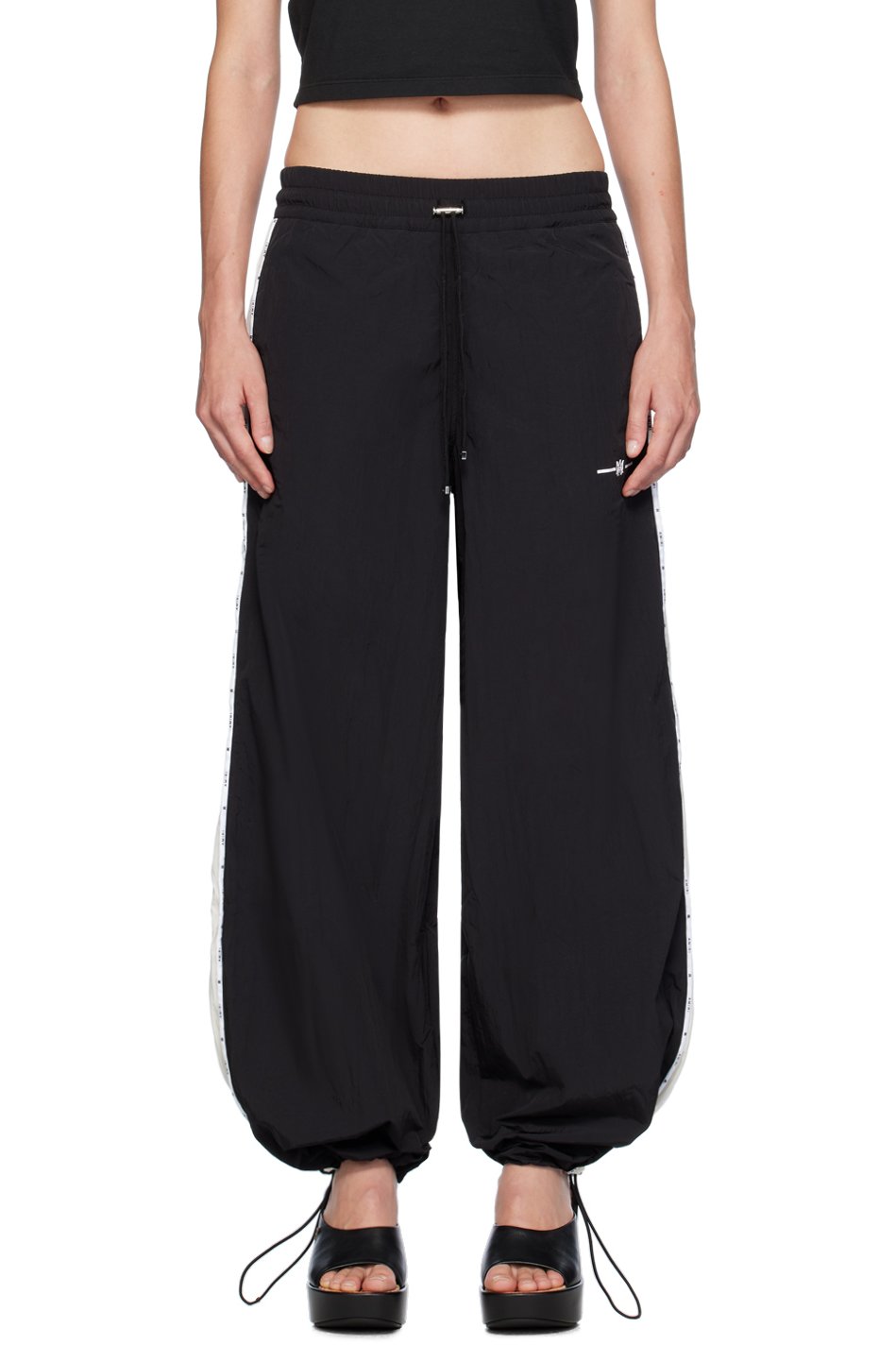 AMIRI - Pantalon de survêtement noir à passepoils et à monogrammes