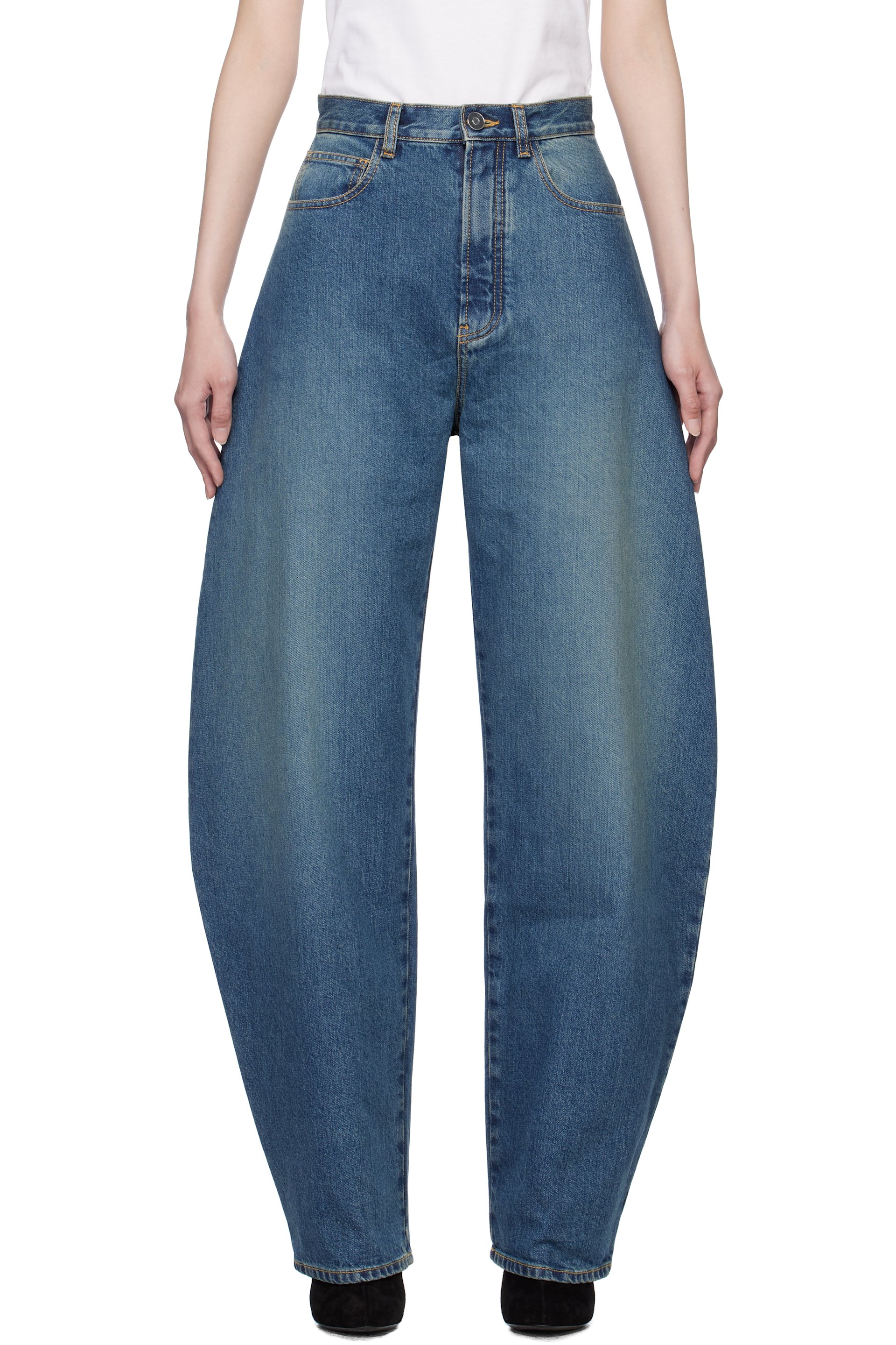 ALAÏA - Jean bleu à coutures extérieures incurvées
