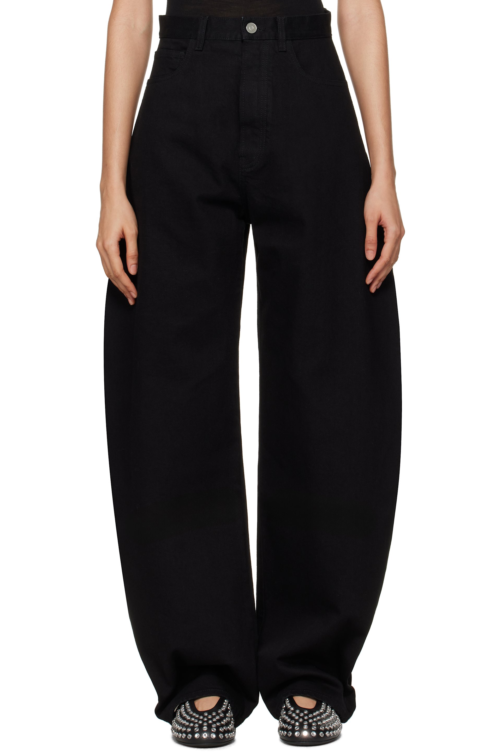 ALAÏA - Jean noir à coutures extérieures incurvées