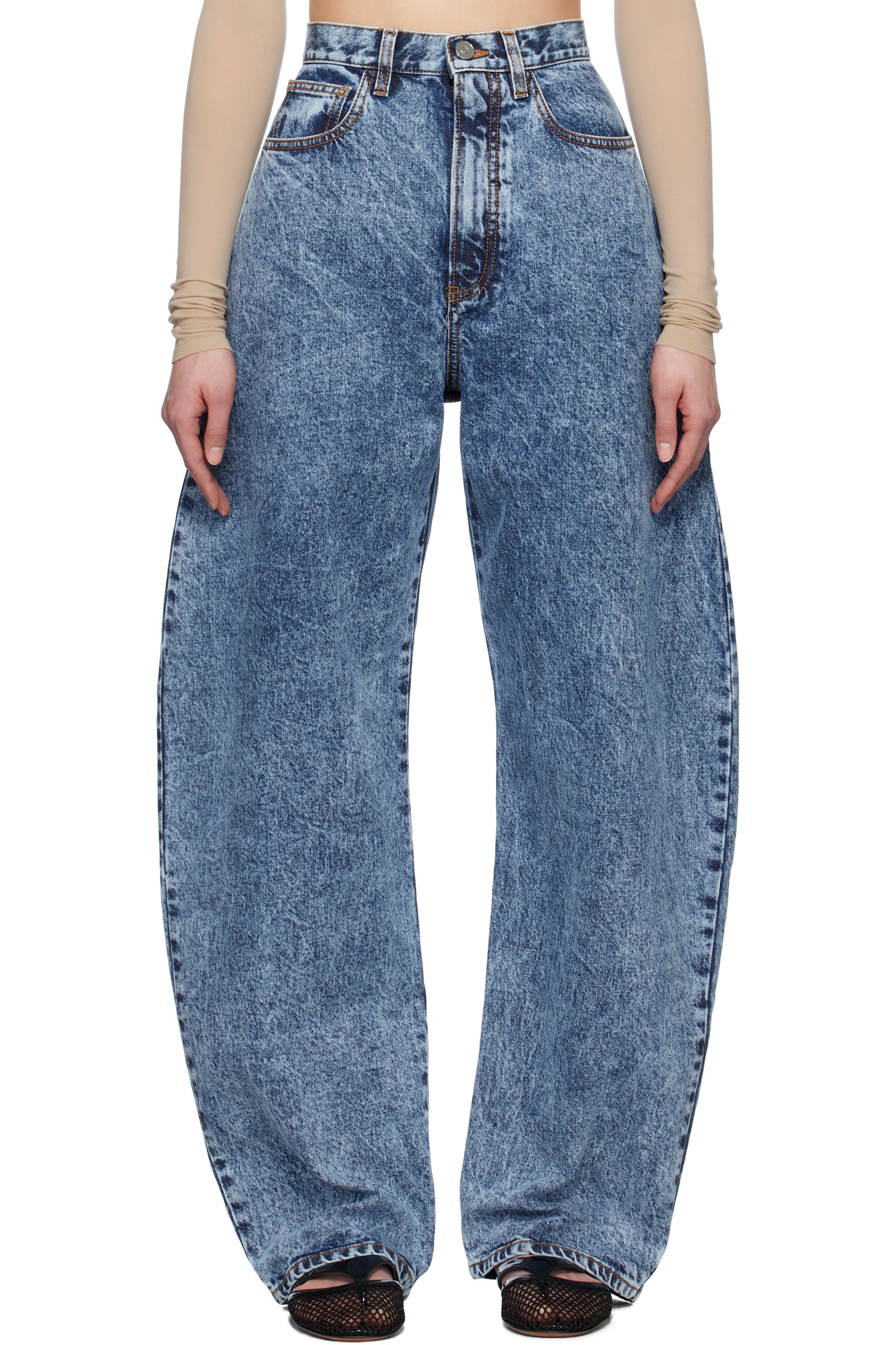 ALAÏA - Jean bleu à coutures extérieures incurvées