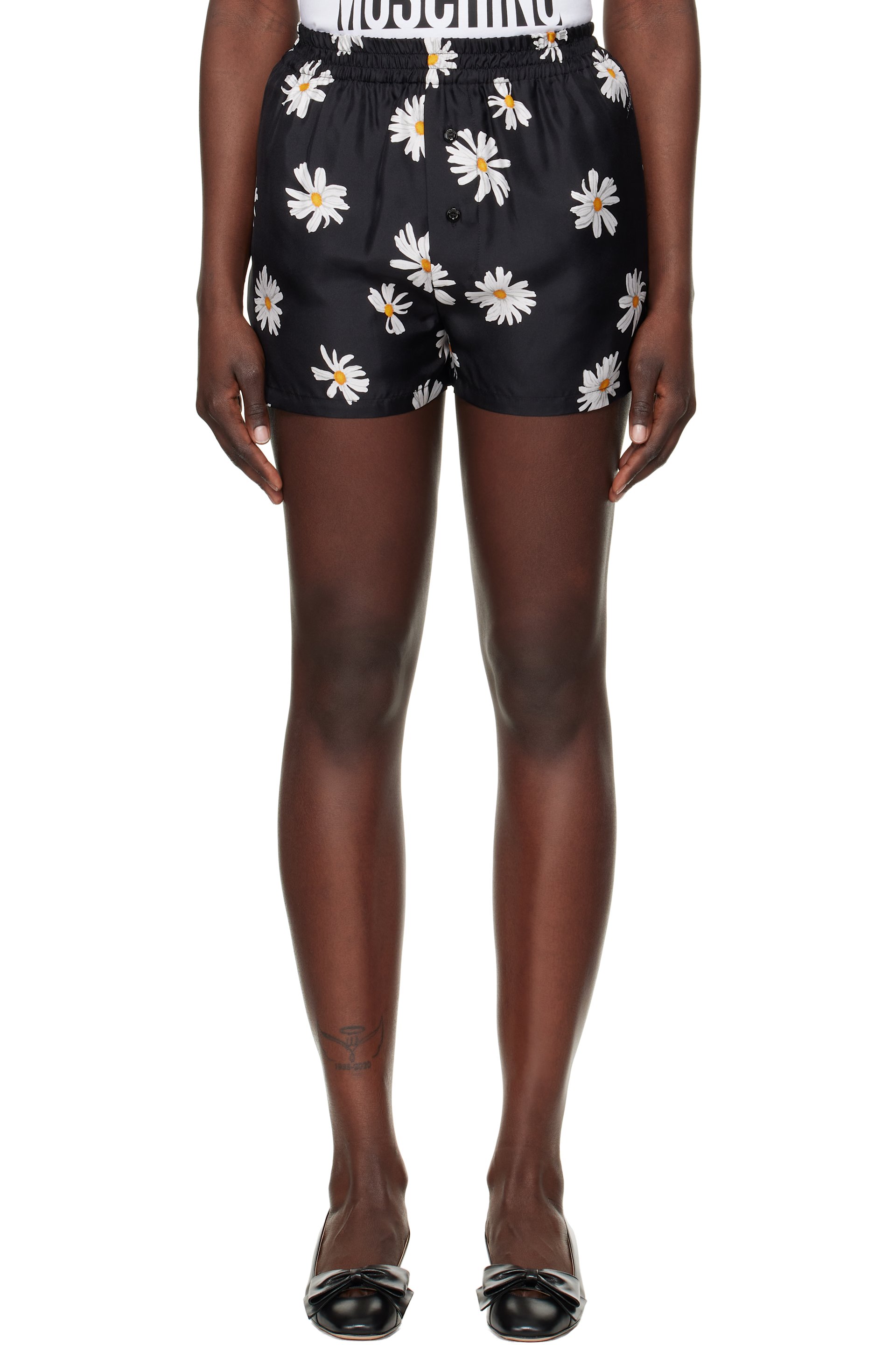 Moschino - Short noir à motif de marguerites imprimé