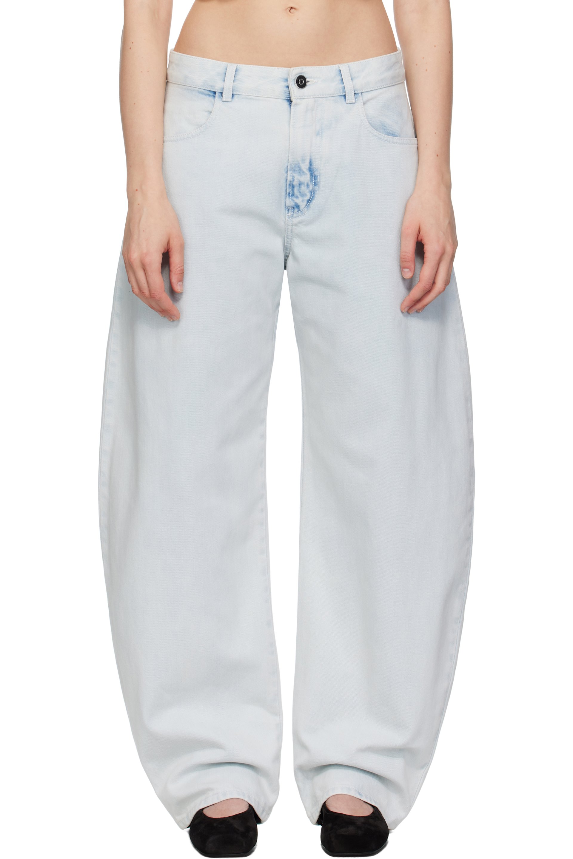 ALAÏA - Jean bleu à taille basse et à coutures extérieures incurvées