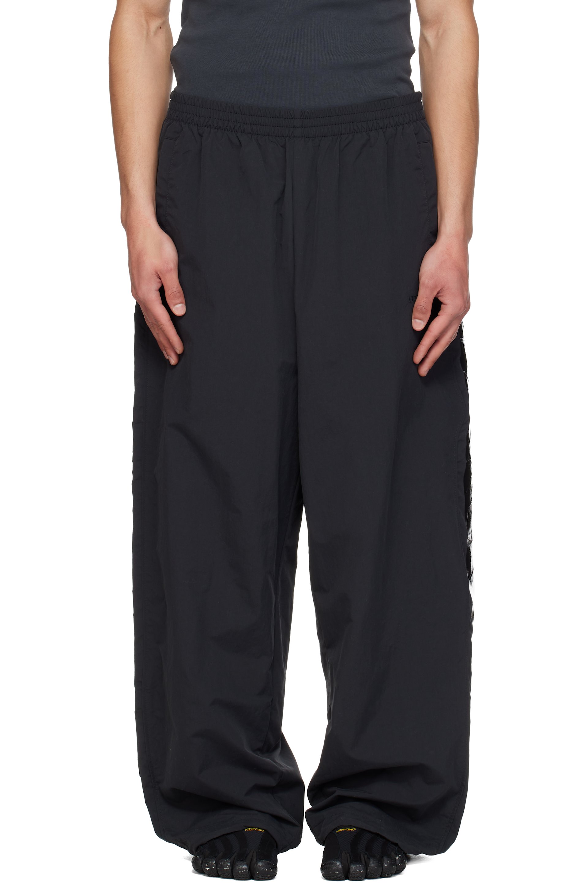 VETEMENTS: Black Taped Track Pants | SSENSE