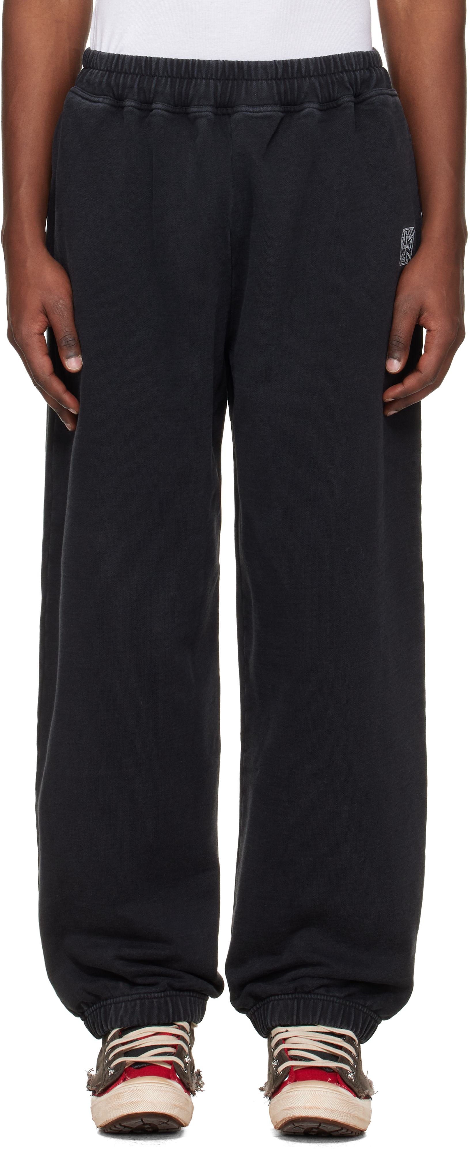 VETEMENTS: Black Biker Cross Logo Sweatpants | SSENSE
