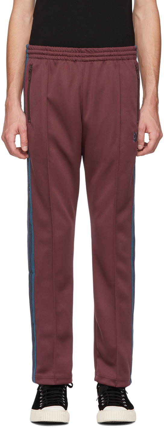 NEEDLES: Burgundy Narrow Track Pants | SSENSE