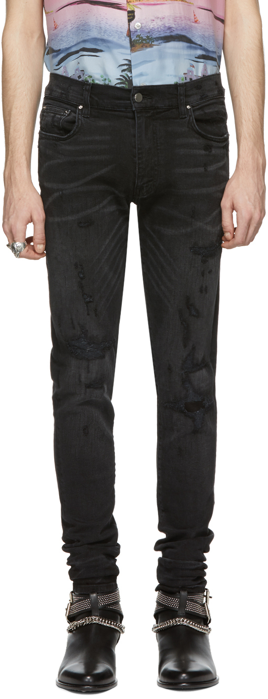 AMIRI: Black Bruise Repaired Jeans | SSENSE UK