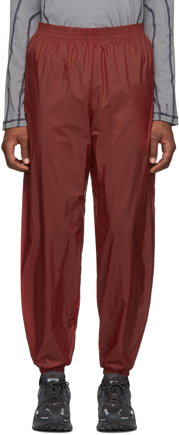 red nylon track pants