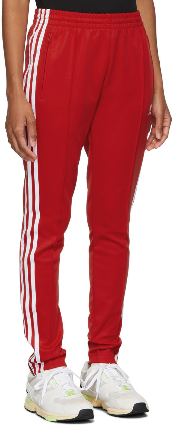 red sst track pants