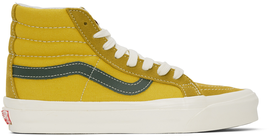 solid yellow vans slip on