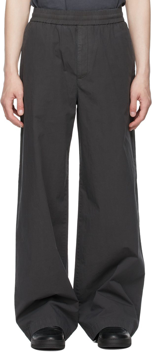 Acne Studios: Grey Fluid Trousers | SSENSE