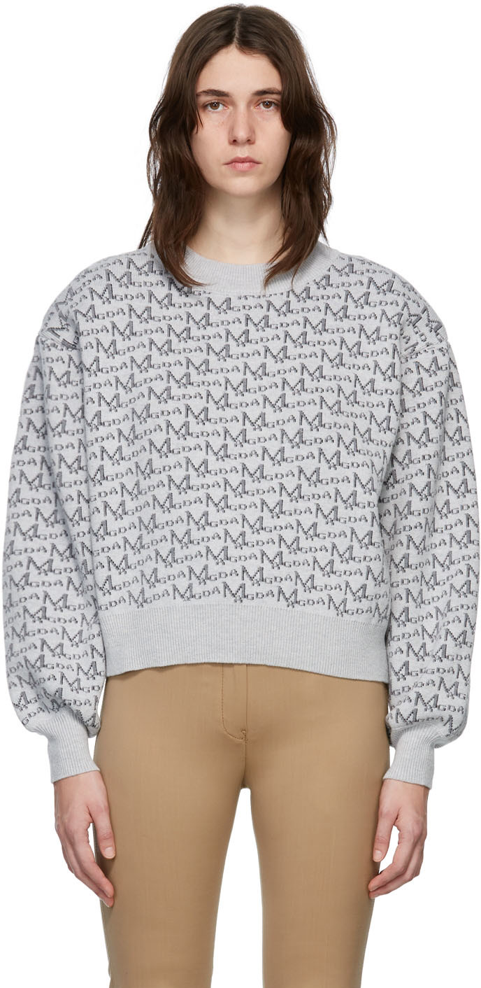 grey branded jumper