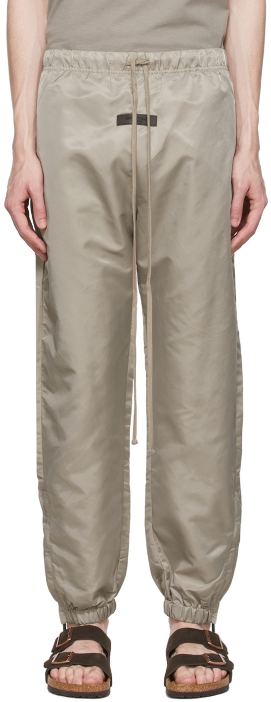 Fear of God ESSENTIALS: Taupe Nylon Track Pants | SSENSE Canada