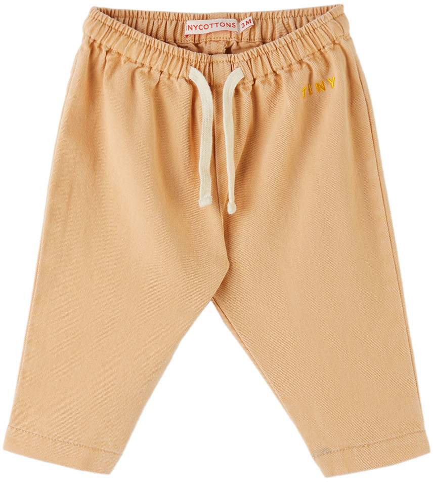 Baby Beige Solid Trousers by TINYCOTTONS on Sale