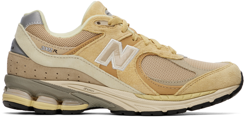 AURALEE: Beige New Balance Edition 2002R Sneakers | SSENSE