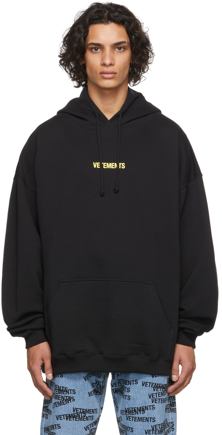 VETEMENTS: Black Logo Label Hoodie | SSENSE