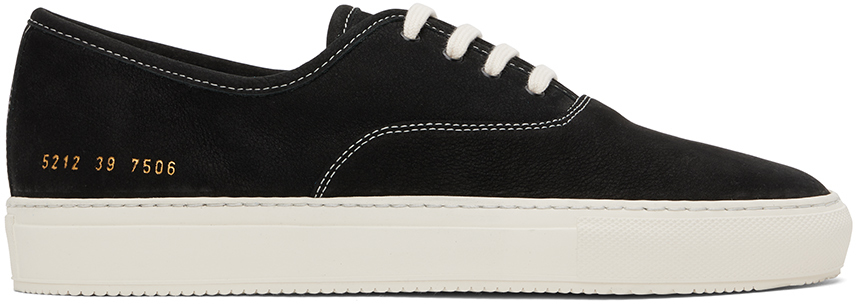 Common Projects: Black Four Hole Sneakers | SSENSE