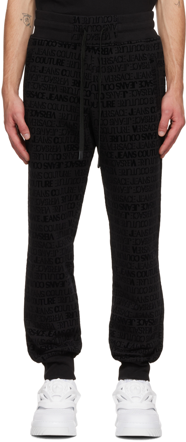 Pantalon de détente à motif à logo floqué Versace Jeans Couture pour homme en coloris Noir élégants et chinos Versace Jeans Couture Homme Pantalons décontractés élégants et chinos Pantalons décontractés 