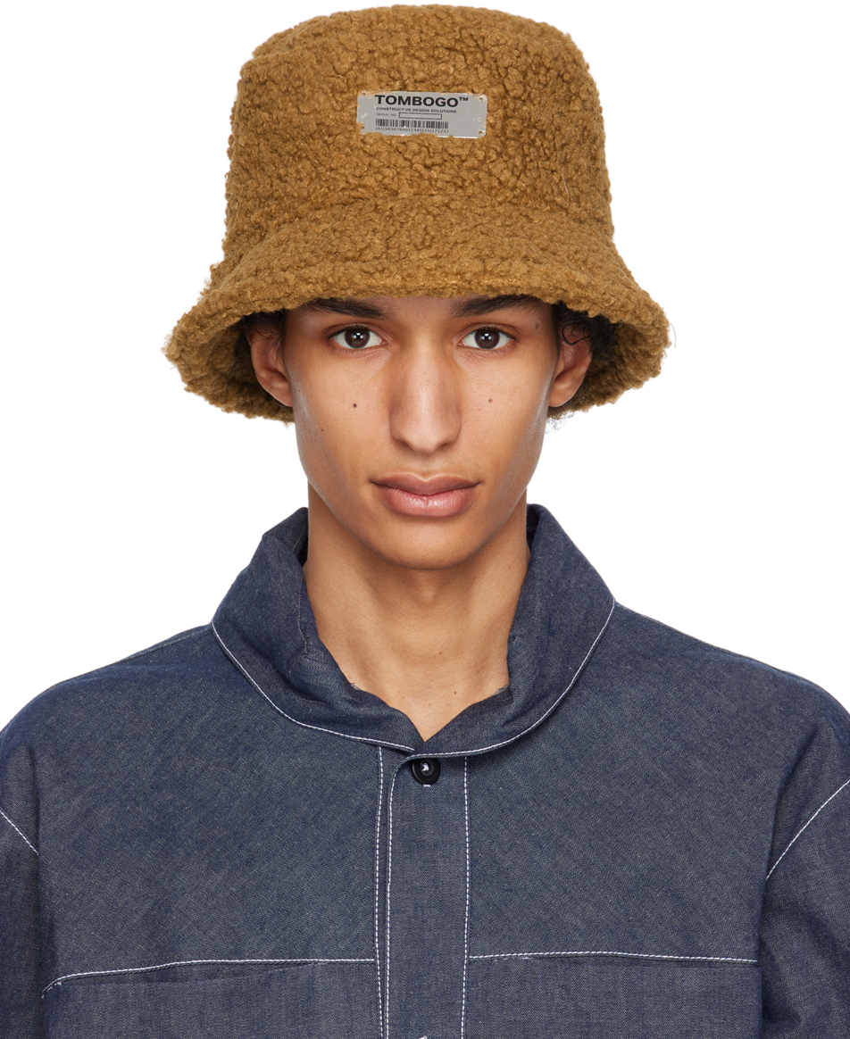 TOMBOGO™: Brown Sherpa Bucket Hat SSENSE Canada