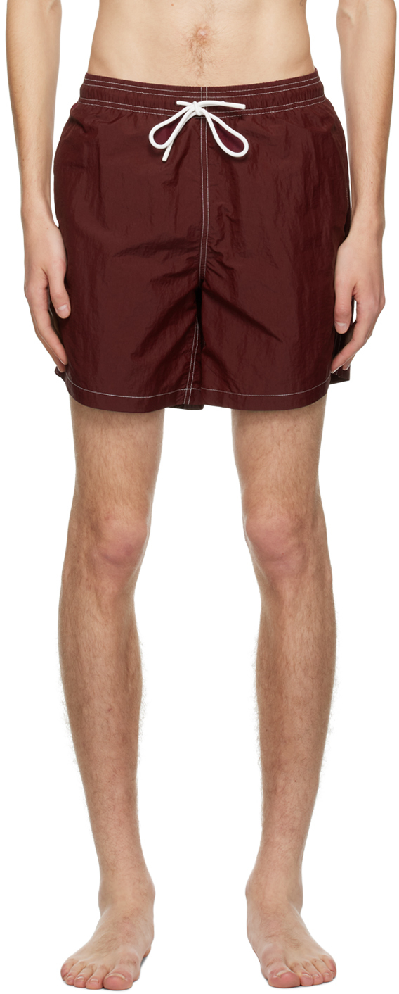 Red Otter Swim Shorts by Adsum on Sale