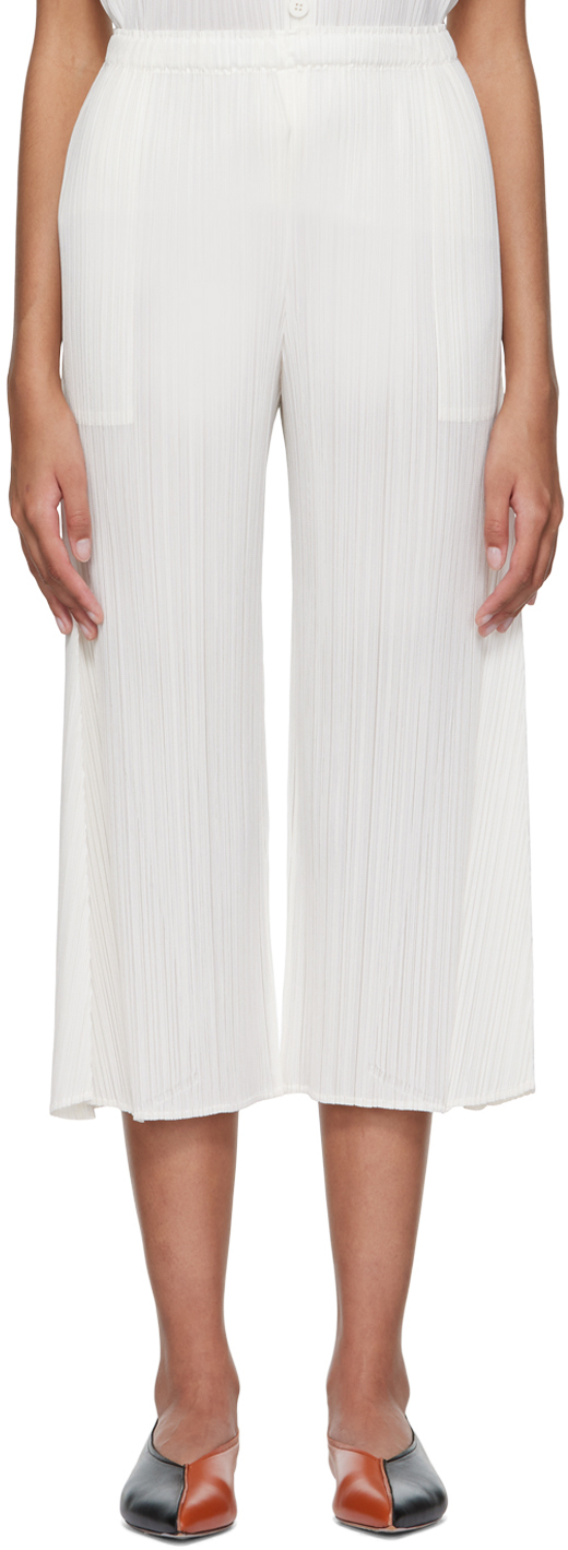 Off-White Polyester Trousers by Pleats Please Issey Miyake on Sale