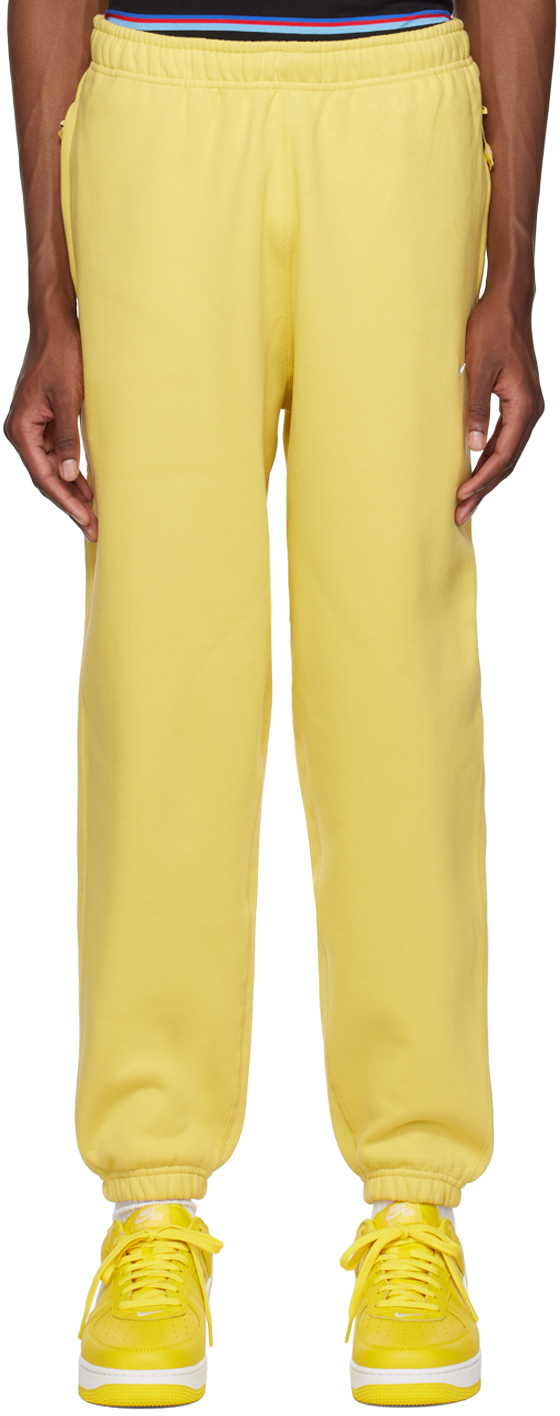 Nike Yellow Embroidered Lounge Pants In Saturn Gold/white