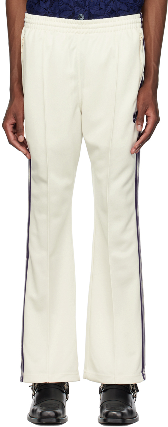 https://img.ssensemedia.com/images/231821M190024_1/needles-off-white-embroidered-track-pants.jpg