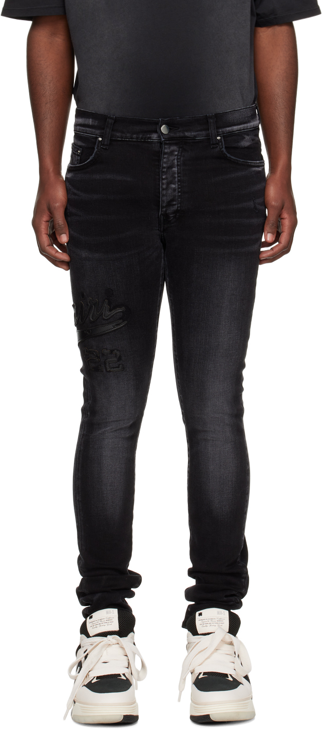 AMIRI: Black Varsity Appliqué Jeans | SSENSE