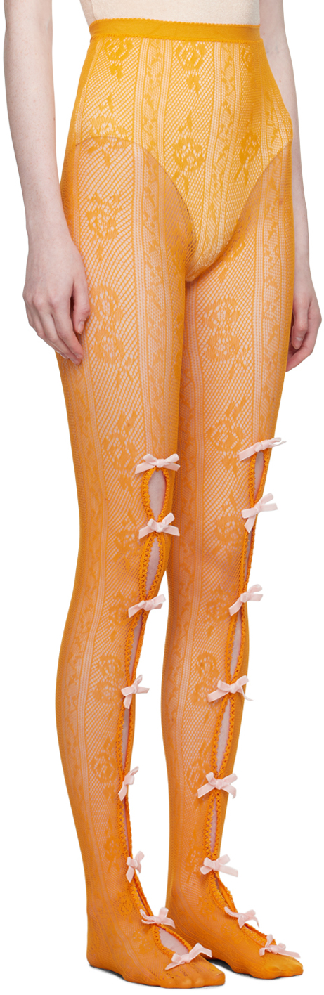 https://img.ssensemedia.com/images/232119F076006_2/ssense-exclusive-orange-bowknot-fishnet-tights.jpg