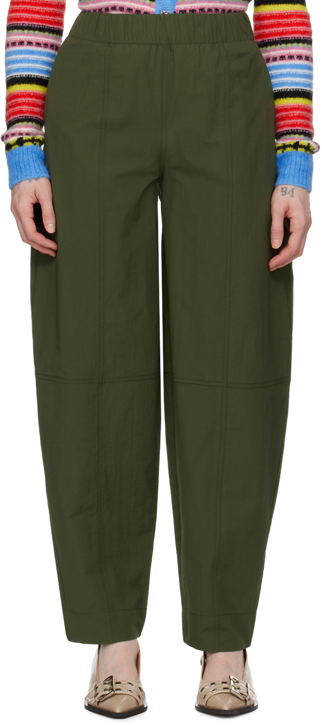 ganni green curved trousers