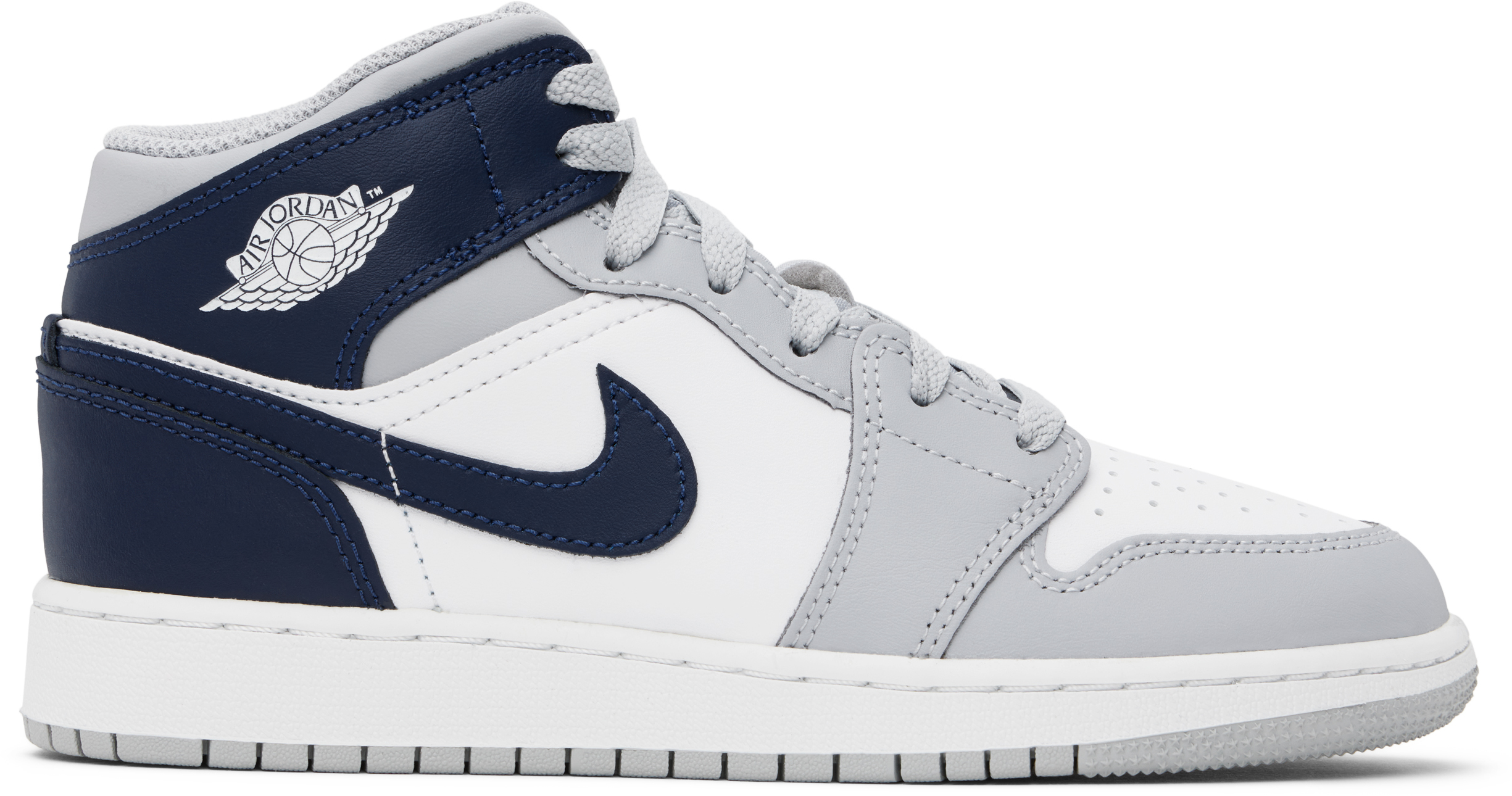 Jeune | Baskets mi-montantes Air Jordan 1 bleu marine et gris par Nike Jordan | SSENSE France