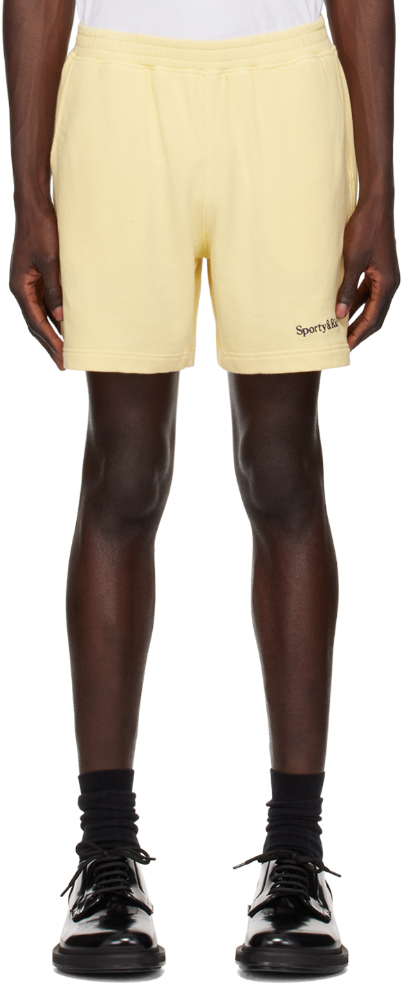 Shop Sporty And Rich Yellow Serif Logo Gym Shorts In Almond