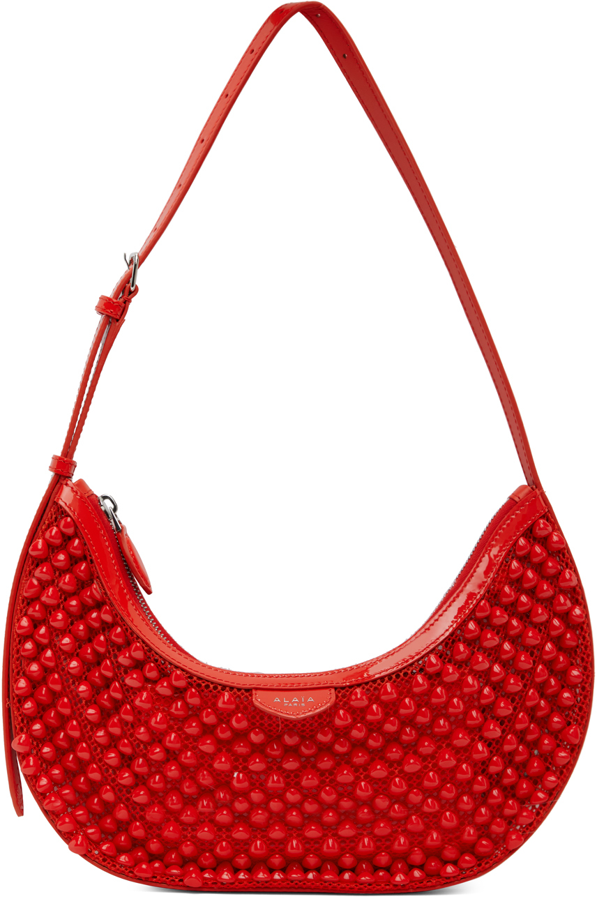 ALAÏA: Orange One Piece Demi Lune Bag | SSENSE