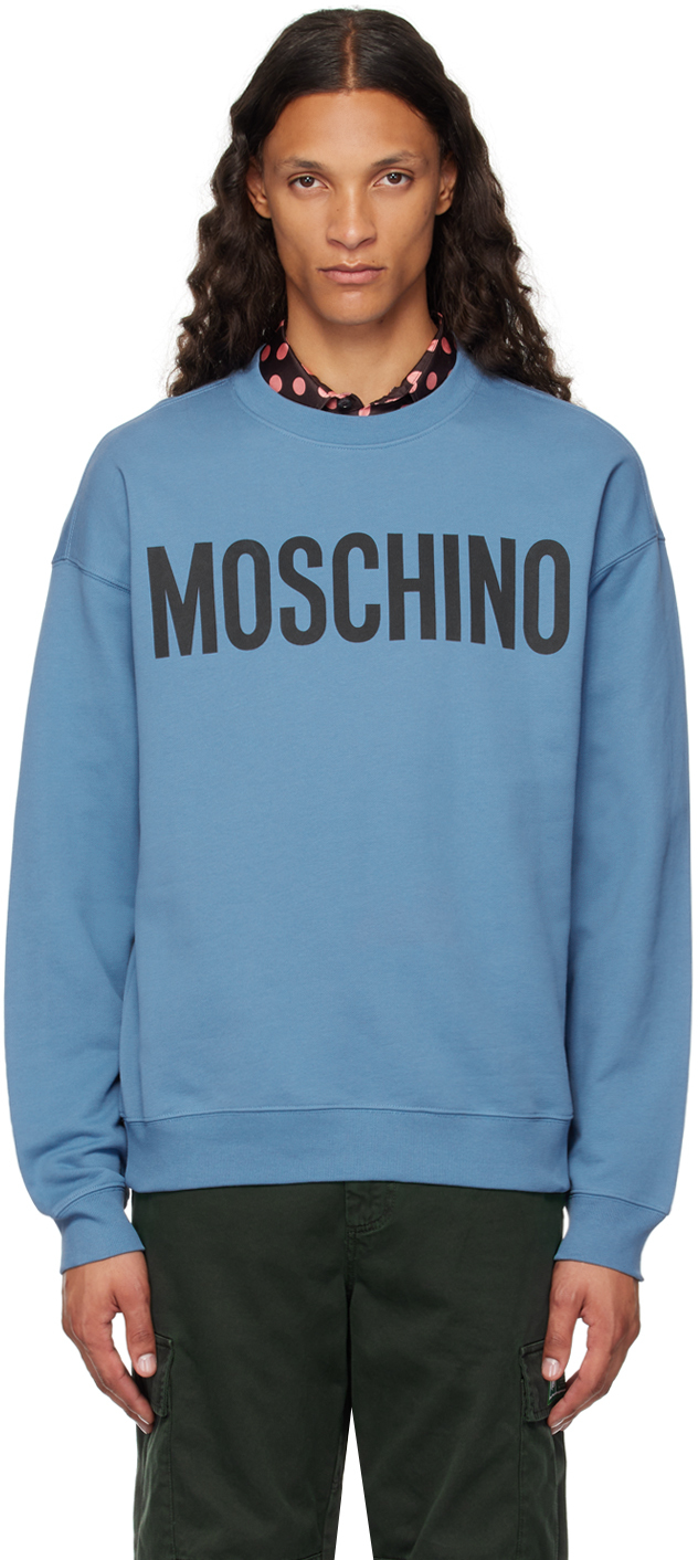 Shop Moschino Blue Printed-logo Sweatshirt In Multi Light Blue