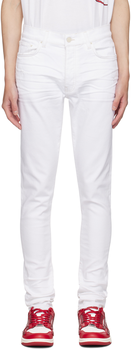 Shop Amiri White Released Hem Skinny Jeans