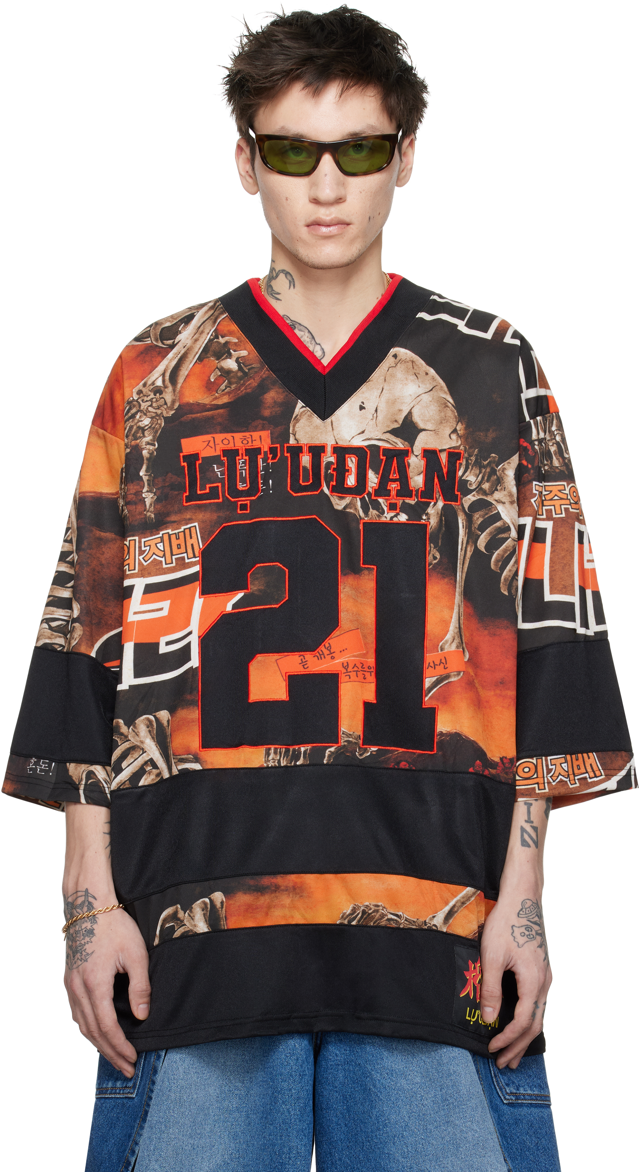 【関税込み】LU'U DAN ブラック＆オレンジ Hockey L-D トップス LU'U DANのブラック＆オレンジ Hockey L-D トップスがセール中