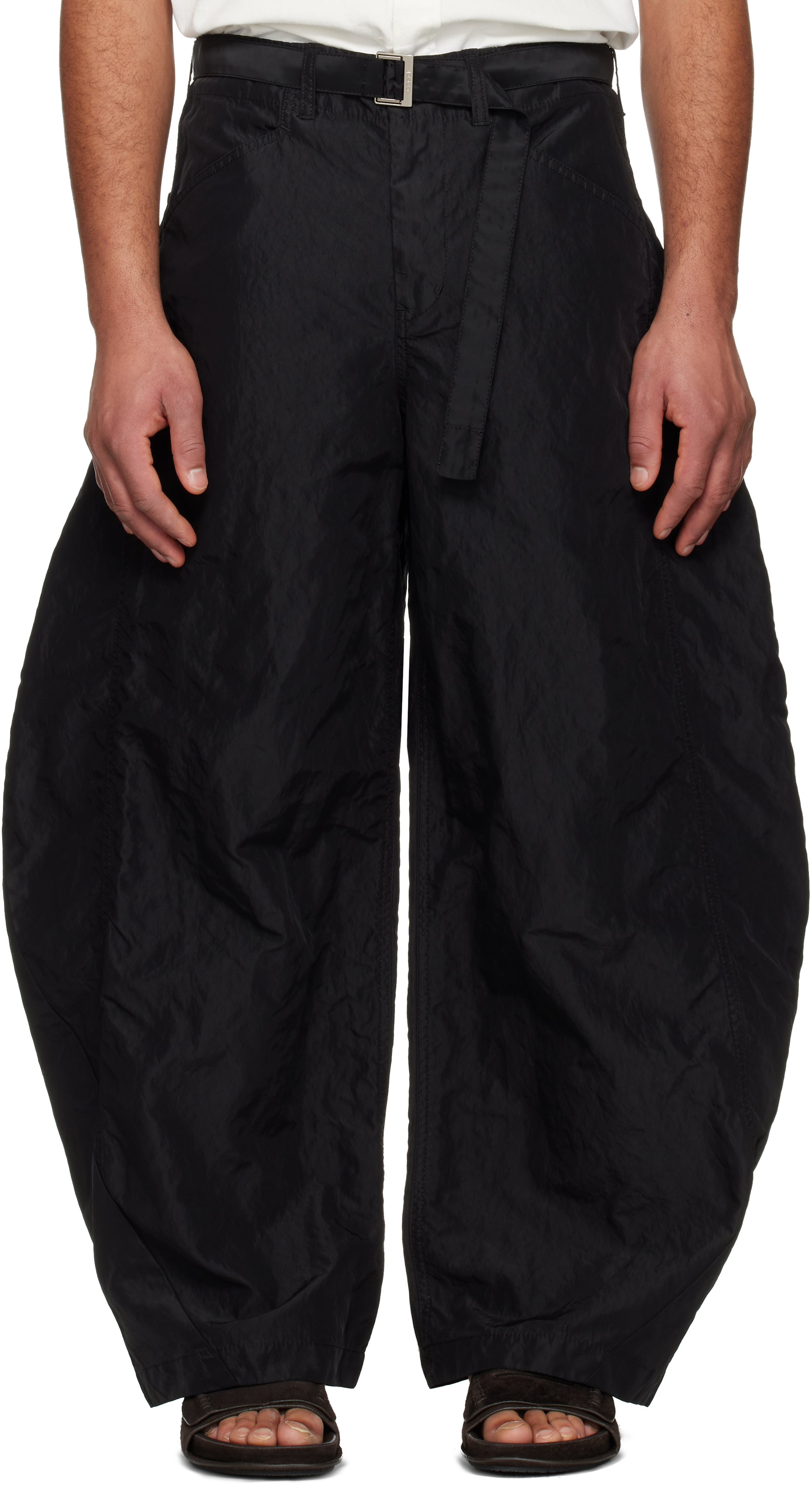 sacai: Black Treated Nylon Twill Trrousers | SSENSE