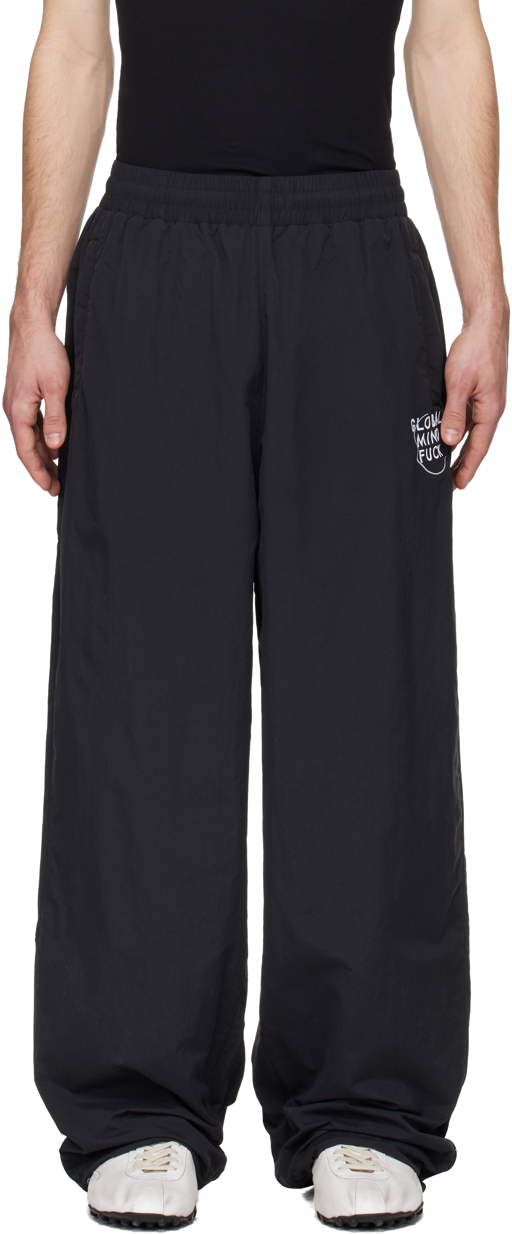 VETEMENTS: Black 'Global MF' Track Pants | SSENSE