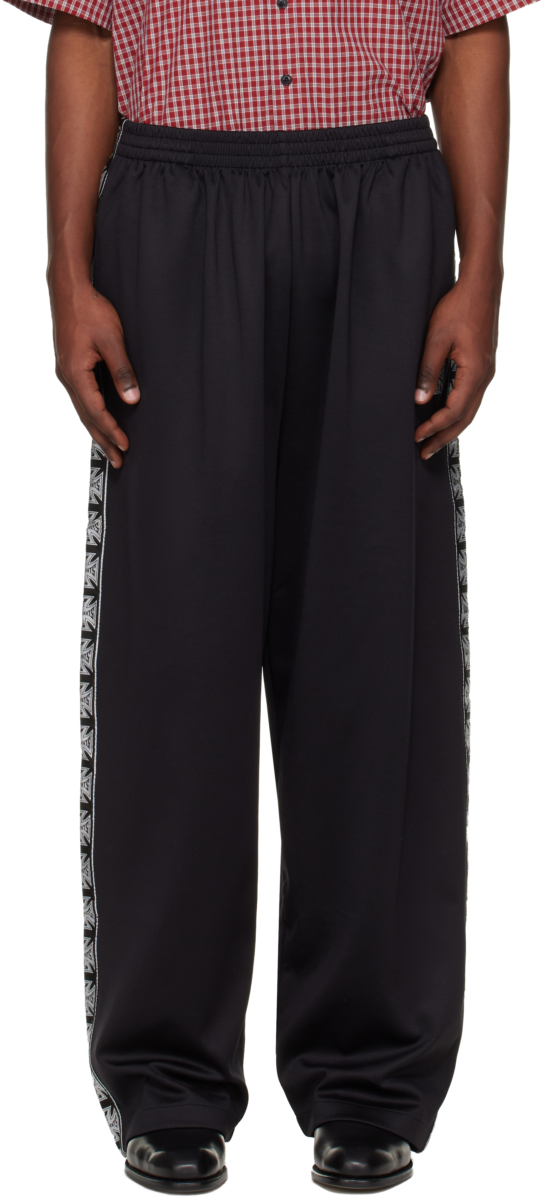 VETEMENTS: Black Biker Cross Tape Track Pants | SSENSE