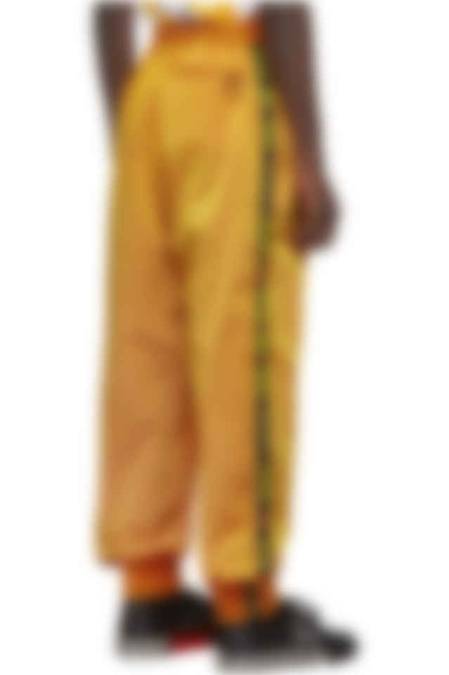 orange and white track pants