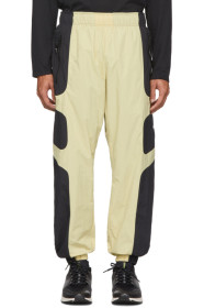 Nike - Pantalon de survêtement beige et noir NSW Re-Issue