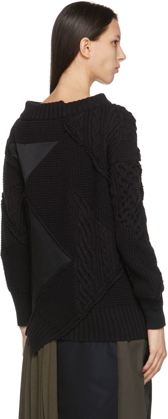 https://img.ssensemedia.com/images/b_white,g_center,f_auto,q_auto:best/211445F096000_3/sacai-black-hank-willis-thomas-edition-mix-knit-pullover-sweater.jpg