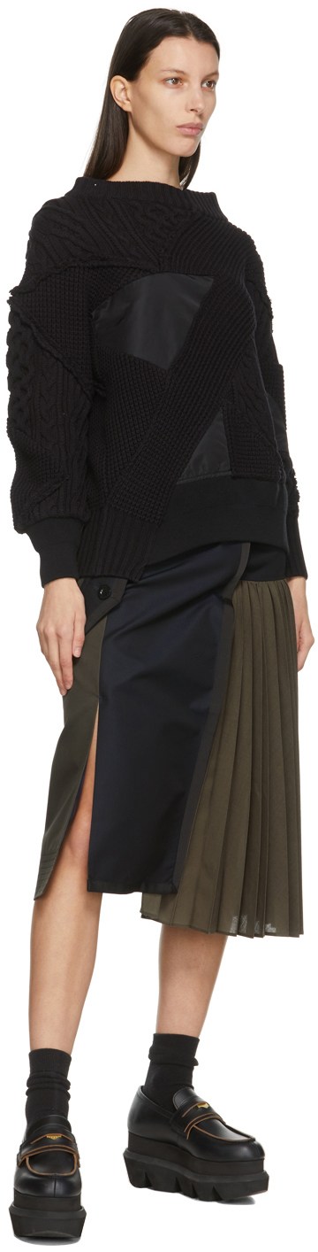 https://img.ssensemedia.com/images/b_white,g_center,f_auto,q_auto:best/211445F096000_4/sacai-black-hank-willis-thomas-edition-mix-knit-pullover-sweater.jpg