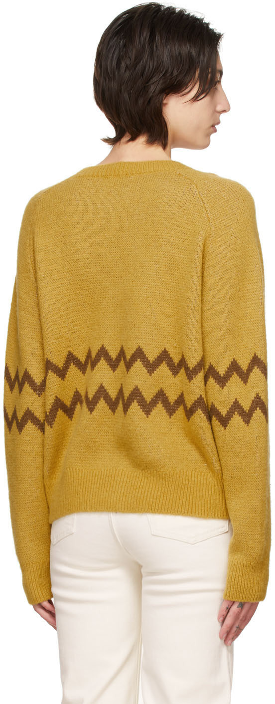 https://img.ssensemedia.com/images/b_white,g_center,f_auto,q_auto:best/211800F096007_3/re-done-yellow-peanuts-edition-50s-classic-sweater.jpg