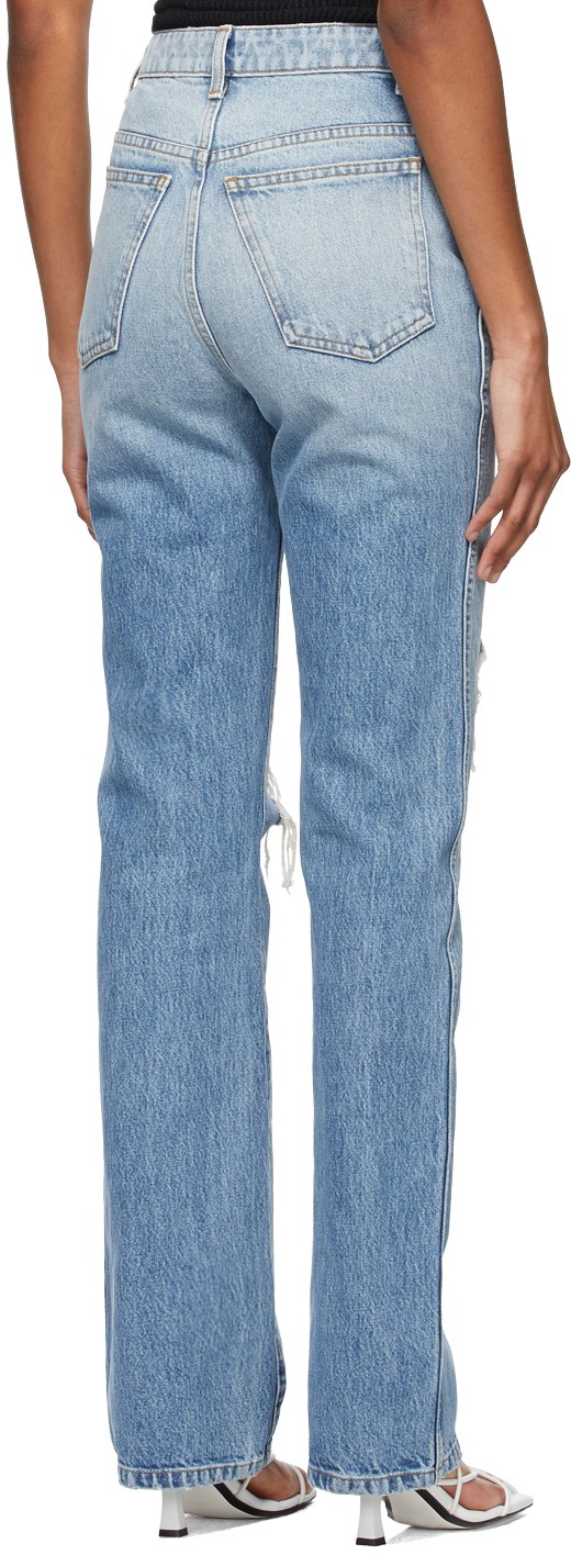 https://img.ssensemedia.com/images/b_white,g_center,f_auto,q_auto:best/211914F069059_3/khaite-blue-ripped-the-danielle-jeans.jpg
