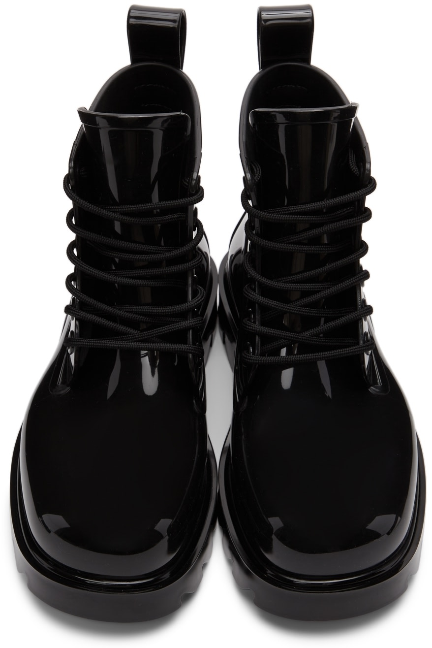 https://img.ssensemedia.com/images/b_white,g_center,f_auto,q_auto:best/212798F113023_5/bottega-veneta-black-stride-ankle-boots.jpg