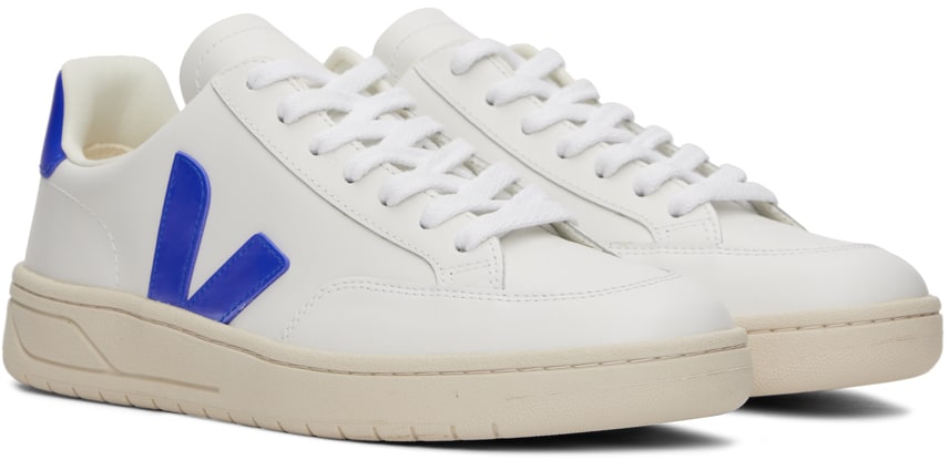 https://img.ssensemedia.com/images/b_white,g_center,f_auto,q_auto:best/231610M237093_4/veja-white-and-blue-v-12-sneakers.jpg