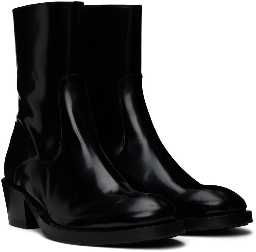 https://img.ssensemedia.com/images/b_white,g_center,f_auto,q_auto:best/231640M223002_4/eytys-black-blaise-chelsea-boots.jpg
