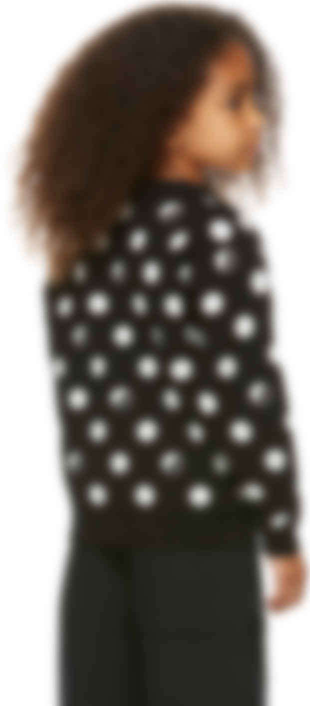 white sweater with black polka dots