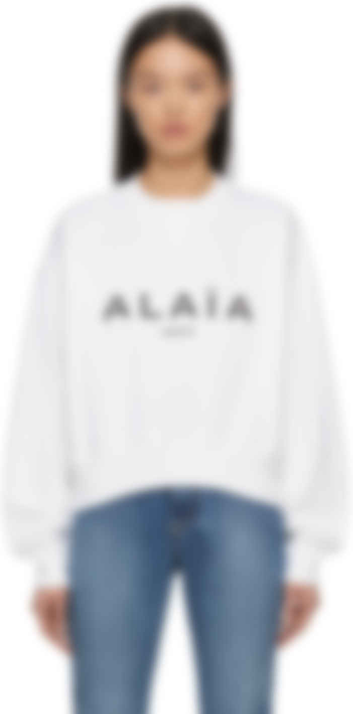 white boxy sweater